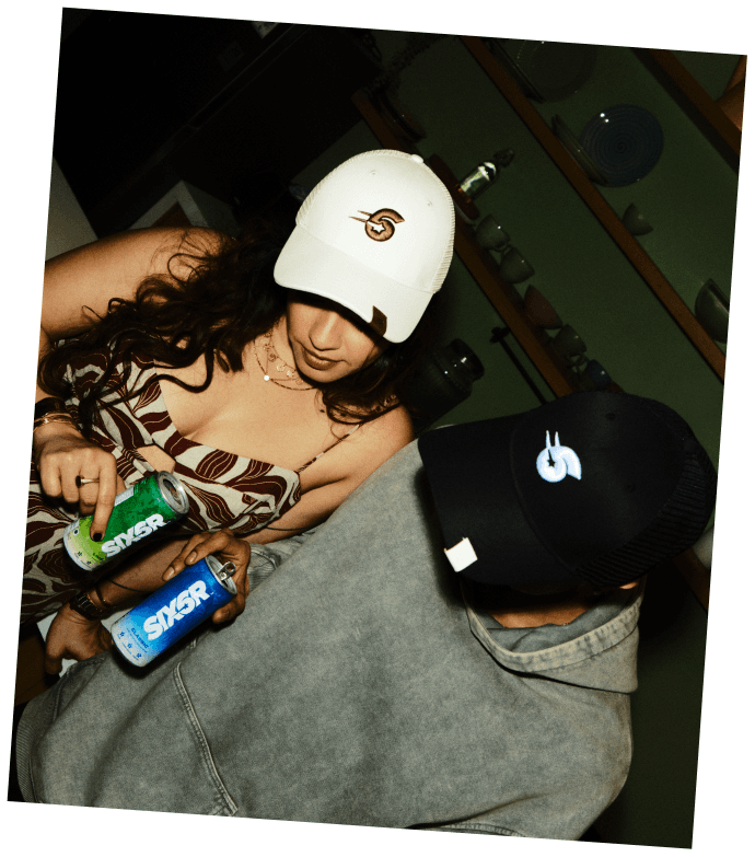 Karan and Rashi cracking open a SIX6R can